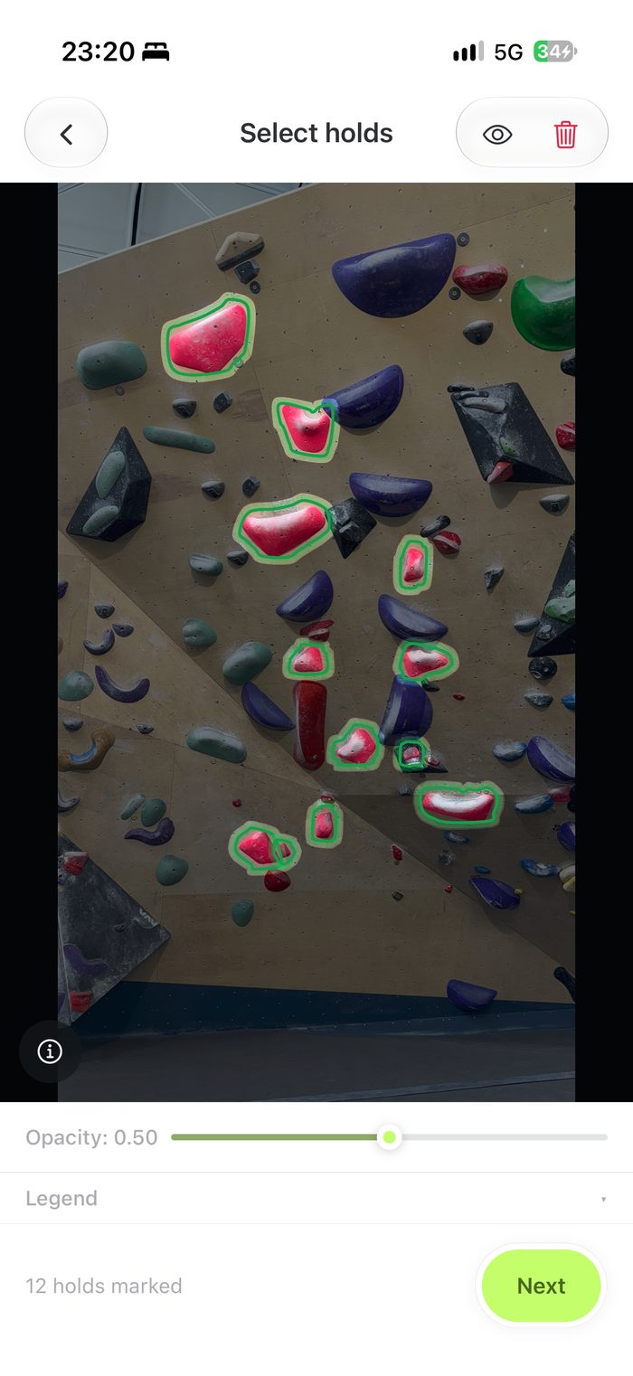 AI-detected hold outlines drawn over a wall photo in Grippy